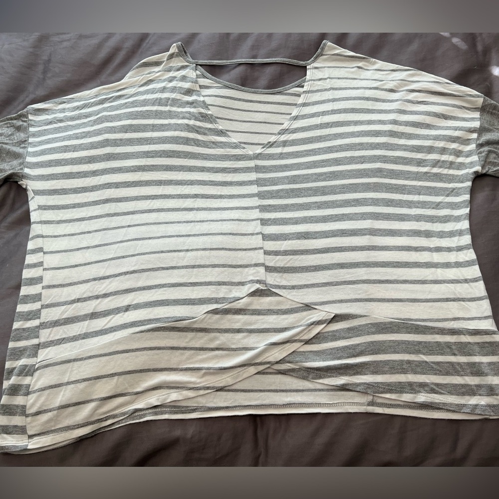 Women’s BKE top cream and grey. Keyhole and crisscross design on back.